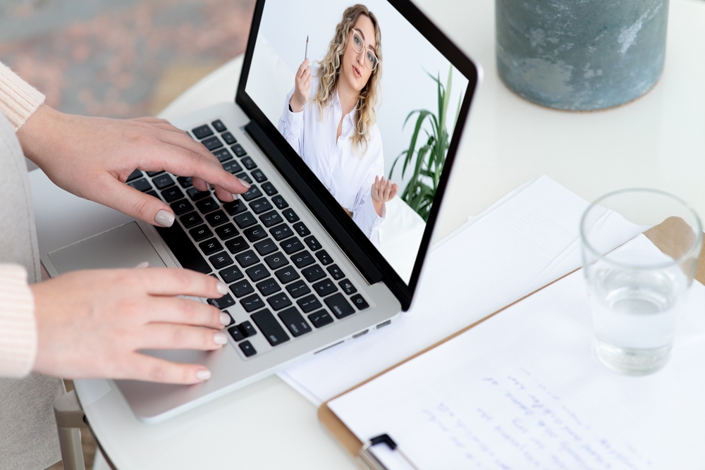 Woman,Patient,Listens,To,Lady,Psychologist,Consultation,By,Videocall,Via